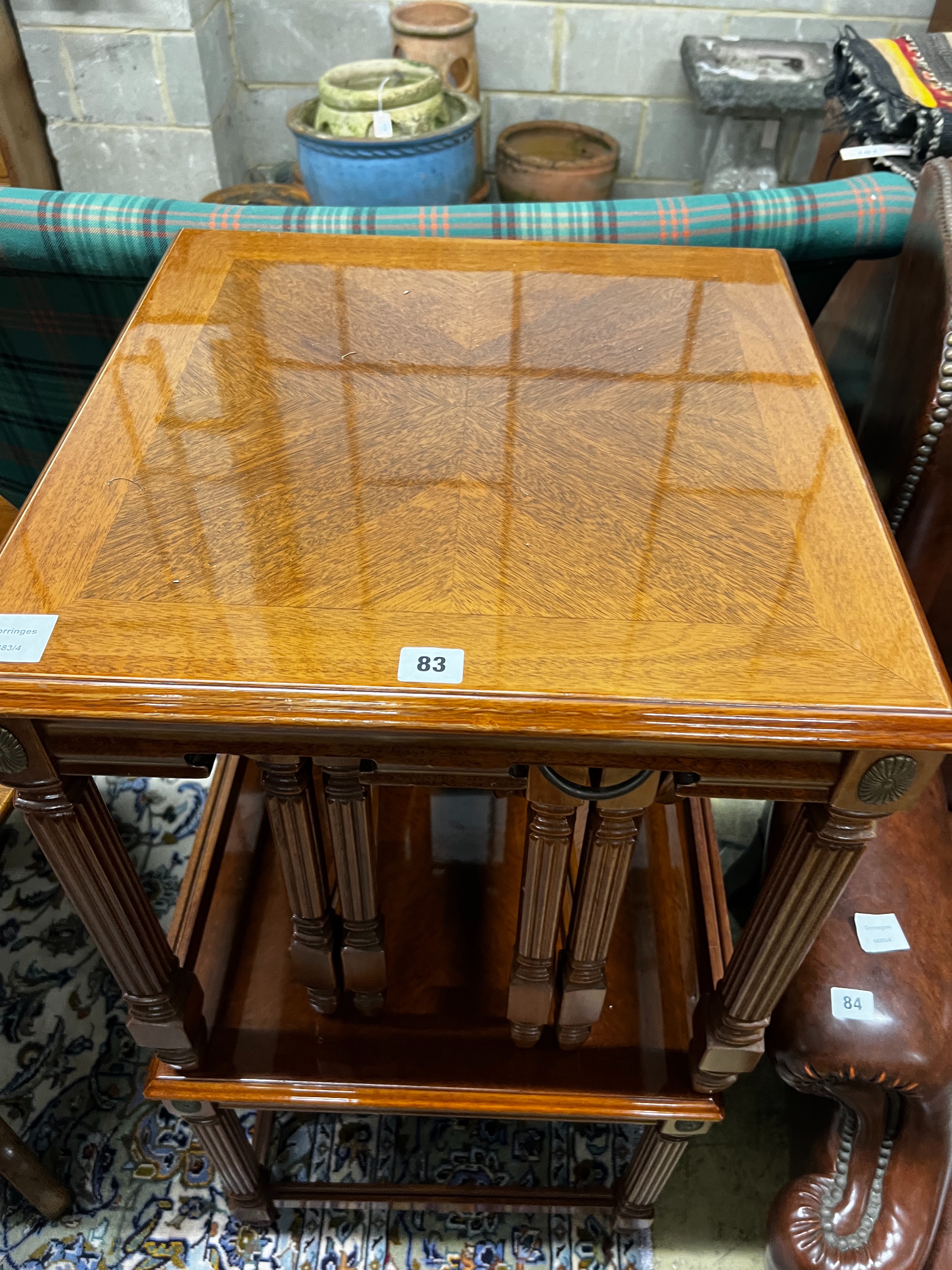 A pair of square reproduction walnut nests of tables, width 51cm, height 53cm